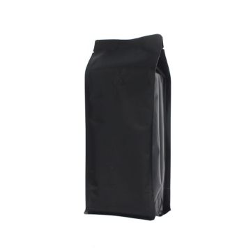 Matte black flat bottom coffee pouch with valve and tear notch.
